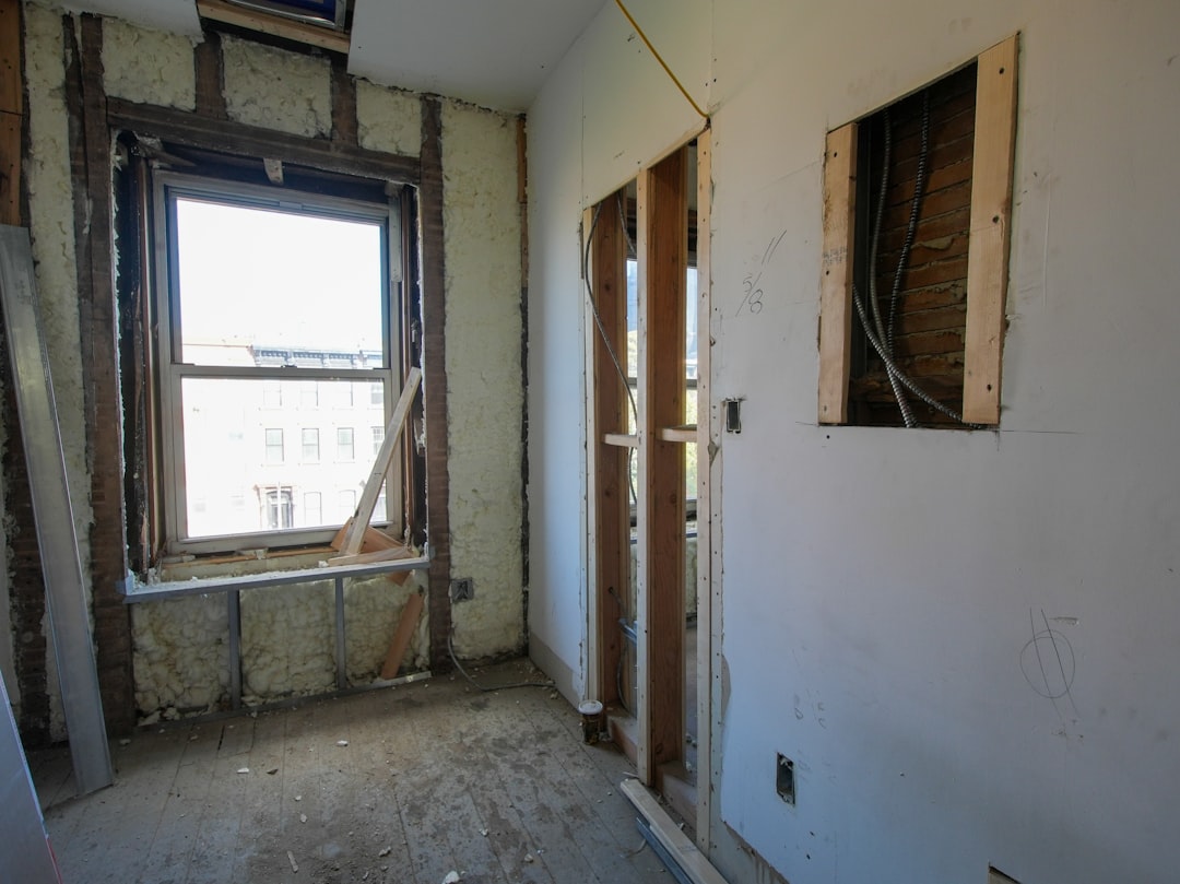 A three-story brownstone stands in mid-transformation, captured at the raw and honest “before” stage of a full interior renovation. These images document a moment that usually disappears once the walls are closed and the finishes are installed — exposed framing, stripped ceilings, rough staircases, and open corridors that reveal the building’s original structure and hidden history. Light spills in through skylights and tall windows, cutting through layers of dust and unfinished surfaces, creating a quiet contrast between decay and renewal. The space feels both industrial and intimate: narrow